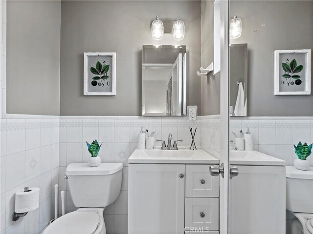 8110 Lesner Ave, Lake Balboa, CA 91406 - bathroom with tile walls, vanity, and wainscoting