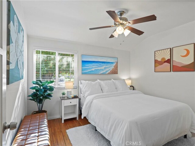 8110 Lesner Ave, Lake Balboa, CA 91406 - bedroom with hardwood / wood-style flooring, lofted ceiling, and a ceiling fan