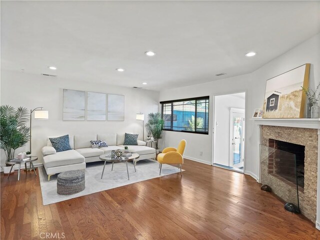 8110 Lesner Ave, Lake Balboa, CA 91406 - living room featuring wood finished floors, recessed lighting, and a fireplace