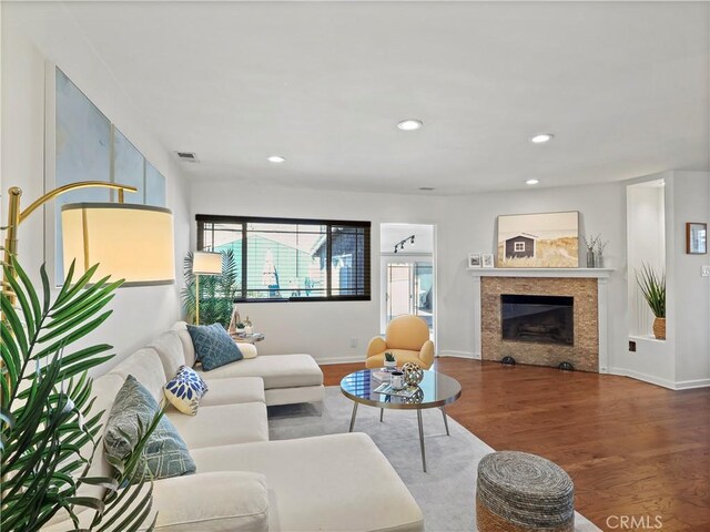 8110 Lesner Ave, Lake Balboa, CA 91406 - living room with wood finished floors, a fireplace, and recessed lighting