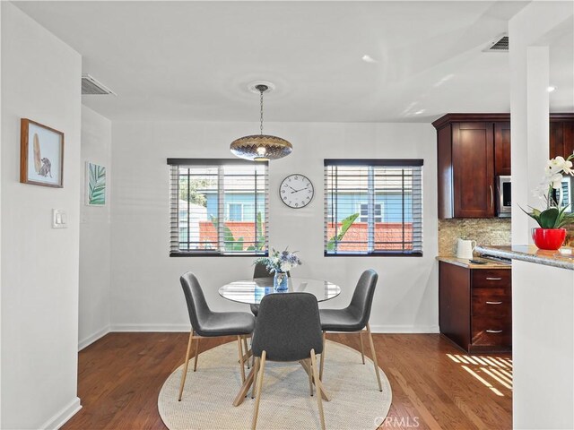 8110 Lesner Ave, Lake Balboa, CA 91406 - dining area with wood finished floors and baseboards