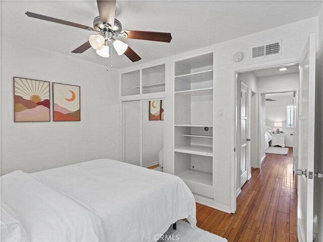 8110 Lesner Ave, Lake Balboa, CA 91406 - bedroom with hardwood / wood-style floors, ceiling fan, and a closet