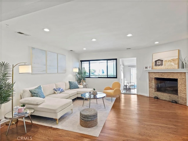 8110 Lesner Ave, Lake Balboa, CA 91406 - living room featuring wood finished floors, recessed lighting, and a fireplace