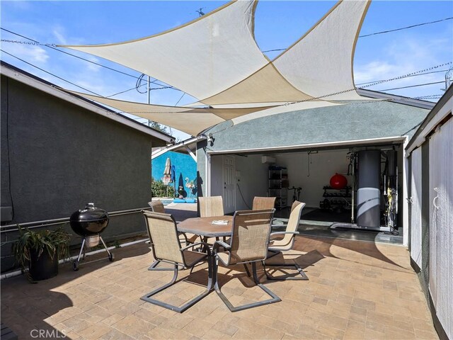 8110 Lesner Ave, Lake Balboa, CA 91406 - view of patio featuring outdoor dining space and water heater