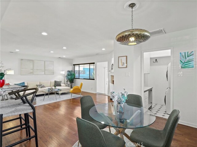 8110 Lesner Ave, Lake Balboa, CA 91406 - dining area featuring recessed lighting, wood finished floors, and washer / dryer