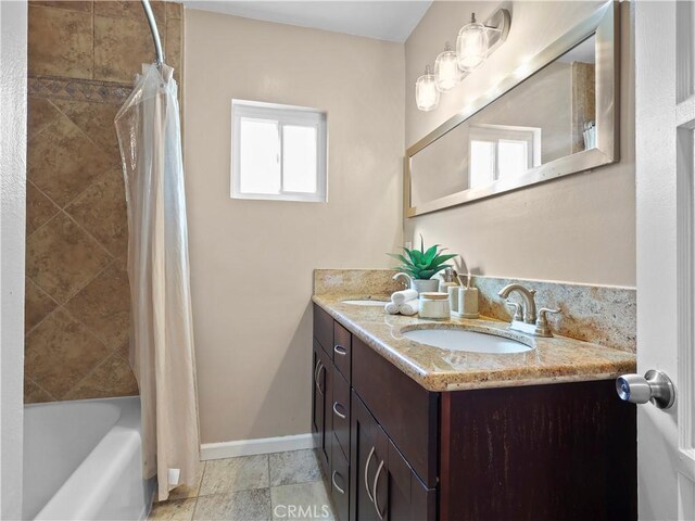 8110 Lesner Ave, Lake Balboa, CA 91406 - full bathroom with double vanity and shower / tub combo
