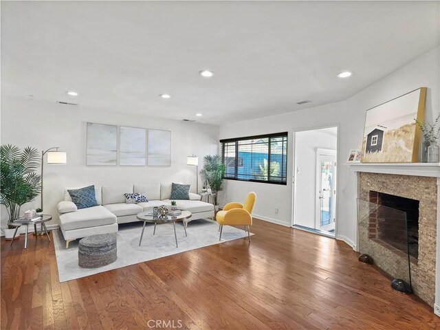 8110 Lesner Ave, Lake Balboa, CA 91406 - living room with wood finished floors, recessed lighting, and a fireplace
