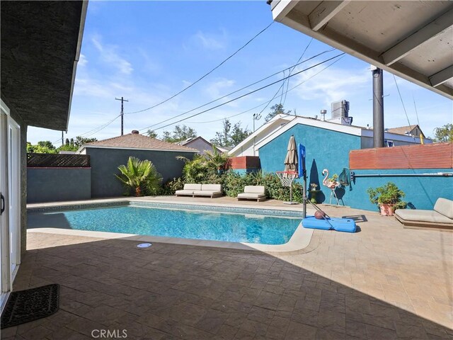 8110 Lesner Ave, Lake Balboa, CA 91406 - view of swimming pool featuring a patio, a fenced backyard, and an outdoor living space
