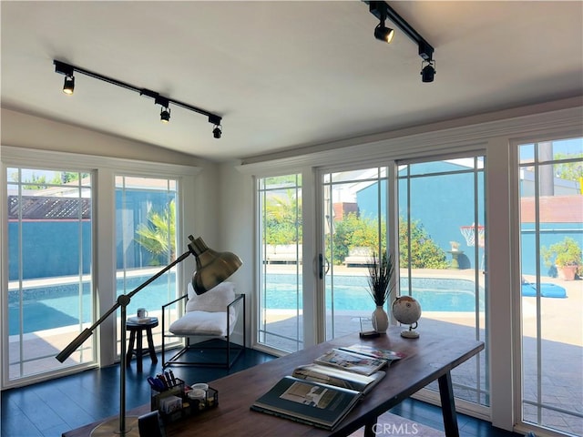 8110 Lesner Ave, Lake Balboa, CA 91406 - office space featuring rail lighting, dark wood-style flooring, healthy amount of natural light, and vaulted ceiling