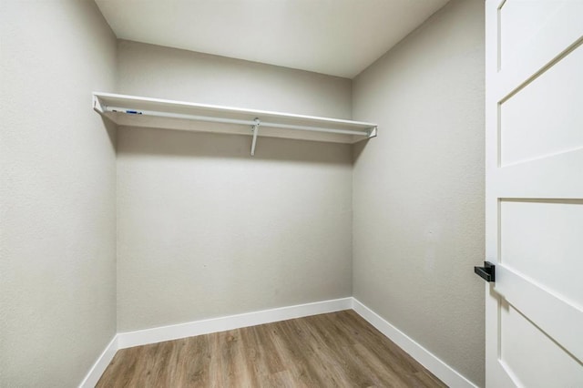 40550 Ventana Ct, Palm Desert, CA 92260 - walk in closet featuring wood finished floors