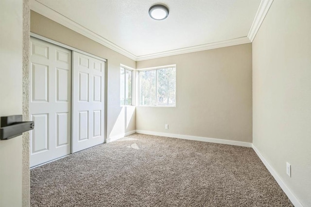 40550 Ventana Ct, Palm Desert, CA 92260 - unfurnished bedroom with crown molding, carpet flooring, baseboards, and a closet