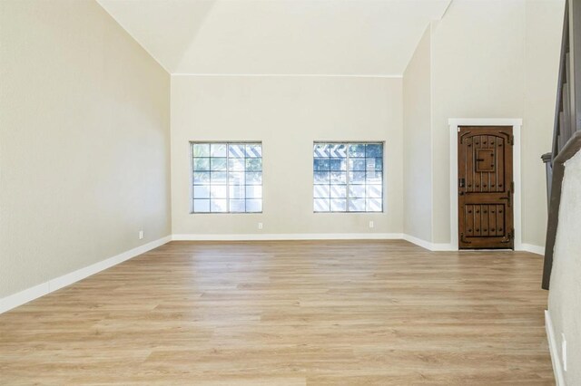 40550 Ventana Ct, Palm Desert, CA 92260 - unfurnished room featuring high vaulted ceiling, light wood-style floors, and baseboards