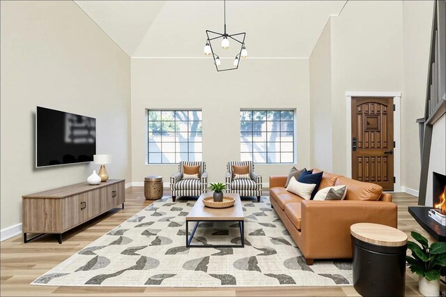 40550 Ventana Ct, Palm Desert, CA 92260 - living room with high vaulted ceiling, light wood finished floors, and baseboards