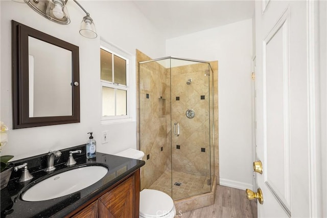 15541 Olive Branch Dr, La Mirada, CA 90638 - bathroom with a stall shower, vanity, toilet, and wood finished floors