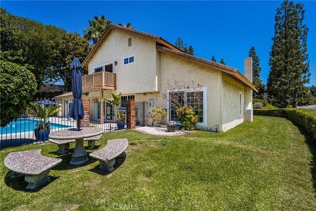 15541 Olive Branch Dr, La Mirada, CA 90638 - back of property with a balcony, stucco siding, and a chimney