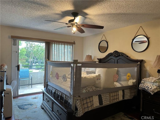 bedroom with access to outside, a textured ceiling, and ceiling fan