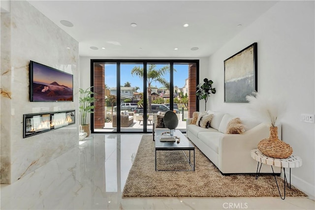 518 8th St, Huntington Beach, CA 92648 - living room featuring a glass covered fireplace, marble tiled floors, and recessed lighting