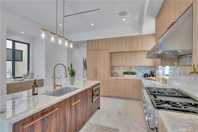518 8th St, Huntington Beach, CA 92648 - kitchen featuring under cabinet range hood, modern cabinets, a sink, appliances with stainless steel finishes, and backsplash