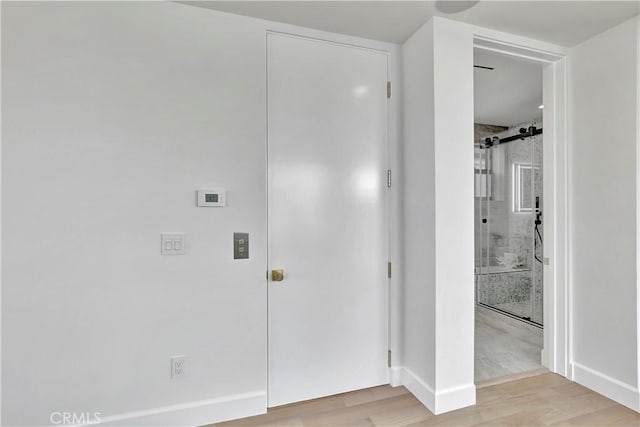 518 8th St, Huntington Beach, CA 92648 - laundry room with light wood finished floors and baseboards