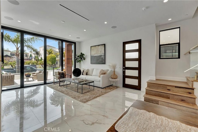 518 8th St, Huntington Beach, CA 92648 - living room with stairs, marble tiled floors, recessed lighting, a wall of windows, and baseboards
