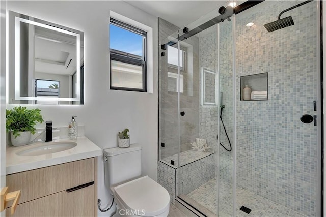 518 8th St, Huntington Beach, CA 92648 - bathroom featuring healthy amount of natural light, a shower stall, toilet, and vanity