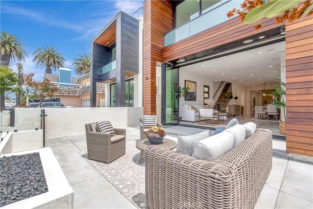 518 8th St, Huntington Beach, CA 92648 - view of patio / terrace featuring an outdoor living space and a balcony