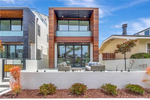 518 8th St, Huntington Beach, CA 92648 - back of house with a fenced front yard and an outdoor living space