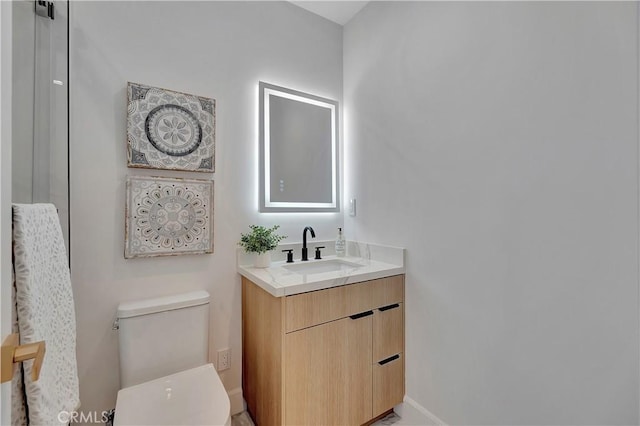 518 8th St, Huntington Beach, CA 92648 - bathroom with baseboards, toilet, and vanity