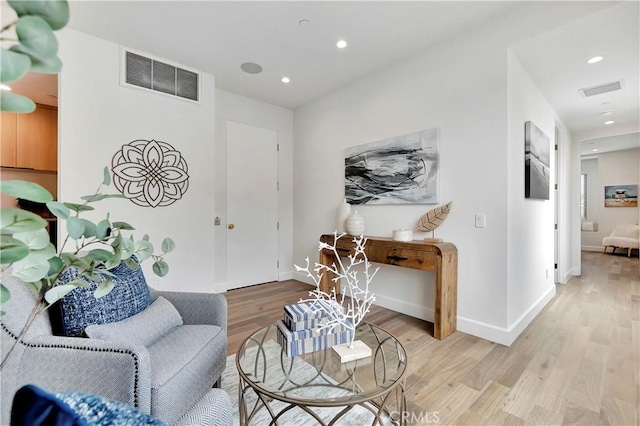 518 8th St, Huntington Beach, CA 92648 - living area featuring light wood finished floors, recessed lighting, and baseboards
