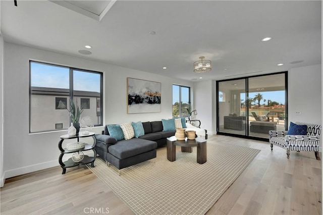 518 8th St, Huntington Beach, CA 92648 - living room featuring light wood-type flooring, recessed lighting, and baseboards