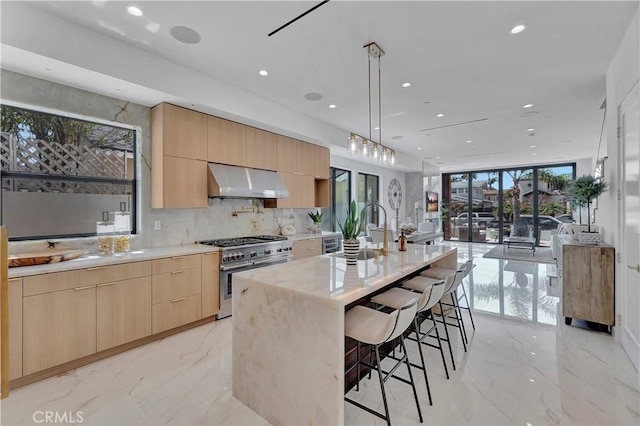 518 8th St, Huntington Beach, CA 92648 - kitchen featuring light brown cabinetry, high end stainless steel range, modern cabinets, a sink, and recessed lighting