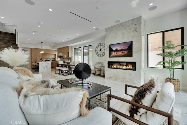 518 8th St, Huntington Beach, CA 92648 - living area with recessed lighting, light marble finish flooring, and a high end fireplace