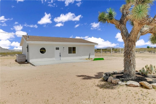 1809 Delgada Ave, Landers, CA 92285 - rear view of house with stucco siding