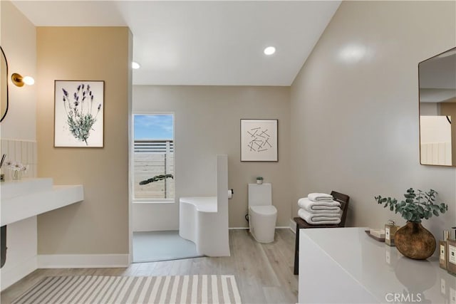 1809 Delgada Ave, Landers, CA 92285 - bathroom featuring wood finished floors, baseboards, toilet, and recessed lighting