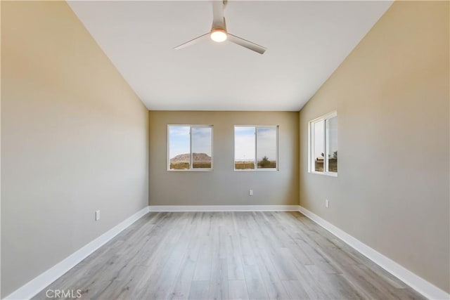 1809 Delgada Ave, Landers, CA 92285 - unfurnished room featuring ceiling fan, light wood-style floors, baseboards, and vaulted ceiling