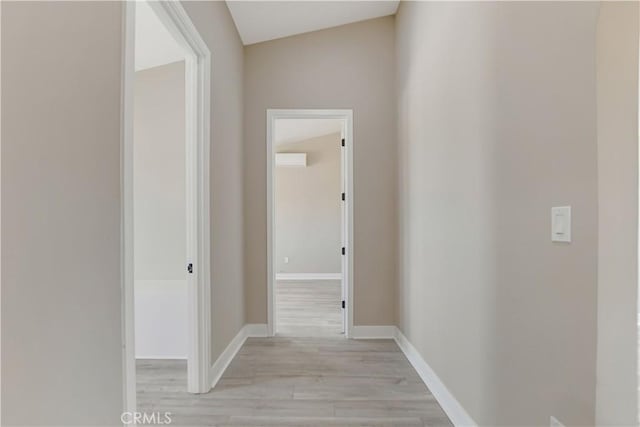 1809 Delgada Ave, Landers, CA 92285 - hall featuring light wood-style flooring and baseboards