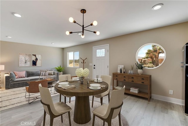 1809 Delgada Ave, Landers, CA 92285 - dining space featuring light wood-type flooring, a chandelier, baseboards, and recessed lighting