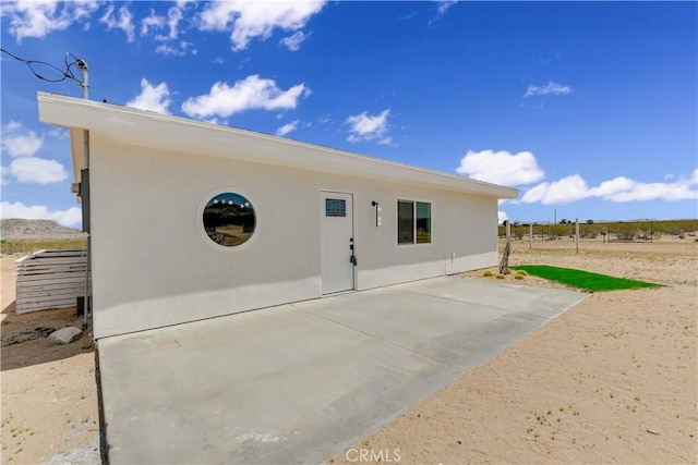 1809 Delgada Ave, Landers, CA 92285 - back of property featuring a patio area and stucco siding