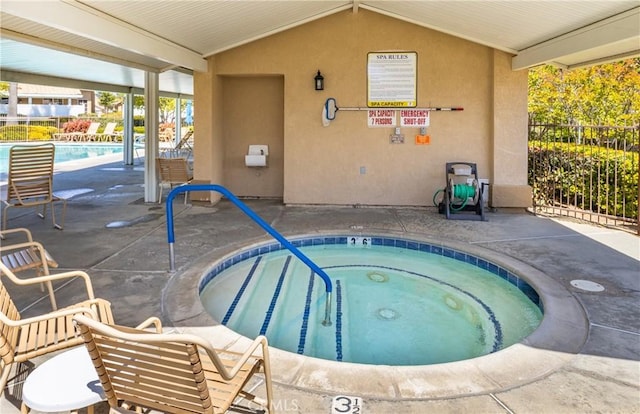 5470 Watson St, Banning, CA 92220 - indoor pool with fence, an in-ground hot tub, and a patio