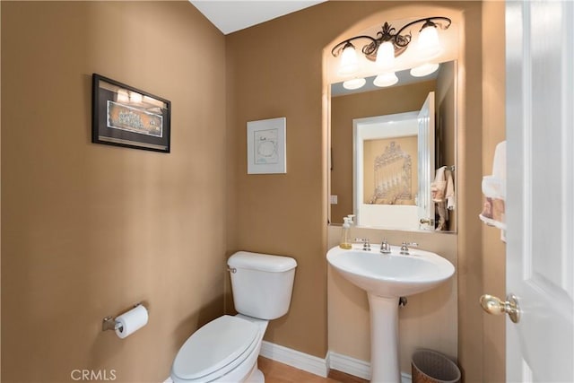 11803 Sortino Ct, Moorpark, CA 93021 - bathroom with toilet, baseboards, and a sink