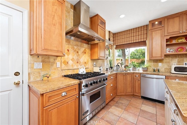 11803 Sortino Ct, Moorpark, CA 93021 - kitchen featuring stainless steel appliances, wall chimney range hood, tasteful backsplash, a sink, and light stone countertops