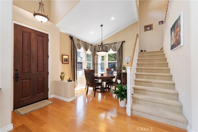 11803 Sortino Ct, Moorpark, CA 93021 - foyer with light wood finished floors, stairway, lofted ceiling, baseboards, and recessed lighting