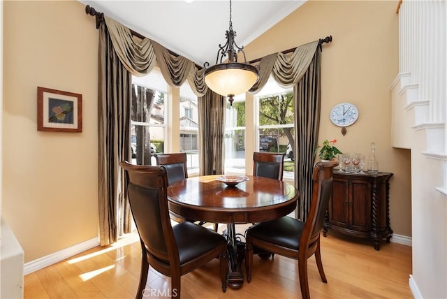 11803 Sortino Ct, Moorpark, CA 93021 - dining space featuring healthy amount of natural light, light wood finished floors, vaulted ceiling, and baseboards