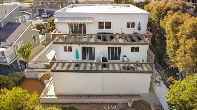 251 Avenida Madrid, San Clemente, CA 92672 - back of house featuring a balcony, stucco siding, and fence