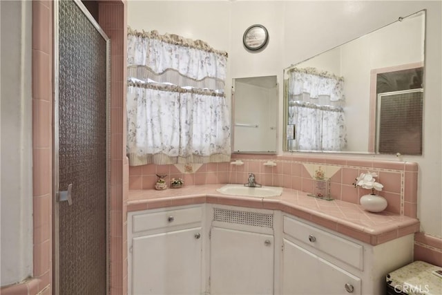 1845 W 91st Pl, Los Angeles, CA 90047 - bathroom featuring tasteful backsplash, a shower stall, and vanity