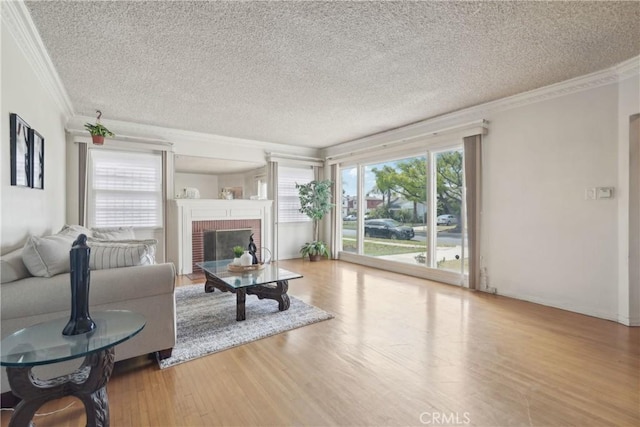 1845 W 91st Pl, Los Angeles, CA 90047 - living room with crown molding, wood finished floors, a brick fireplace, and a textured ceiling