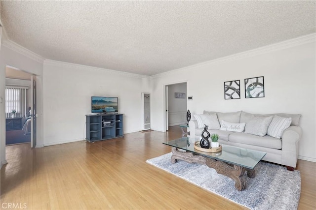 1845 W 91st Pl, Los Angeles, CA 90047 - living area with wood finished floors, a textured ceiling, crown molding, and baseboards