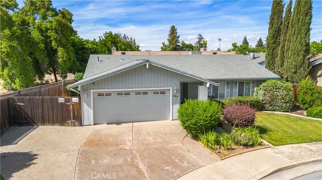 349 Silver Star Ct, Merced, CA 95348 - ranch-style house featuring a garage, fence, a shingled roof, and driveway