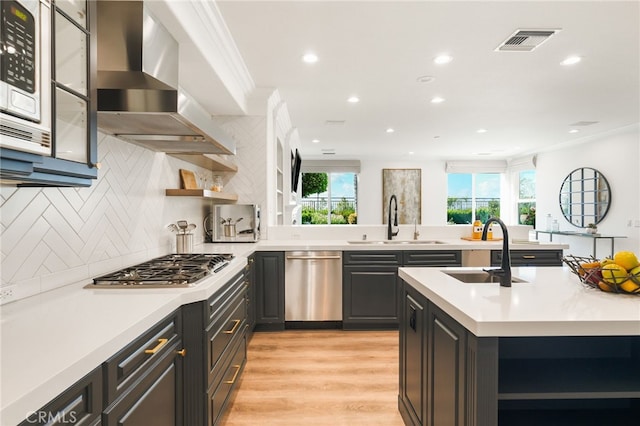 20112 Via Cellini, Porter Ranch, CA 91311 - kitchen featuring appliances with stainless steel finishes, a sink, open shelves, wall chimney exhaust hood, and recessed lighting