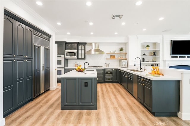 20112 Via Cellini, Porter Ranch, CA 91311 - kitchen with built in appliances, a sink, wall chimney range hood, a kitchen island with sink, and open shelves